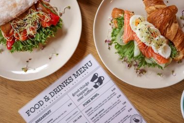 Tasty croissant sandwich with salmon and ciabatta with vegetables, perfect for a balanced meal.